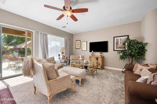 tiled living room with ceiling fan