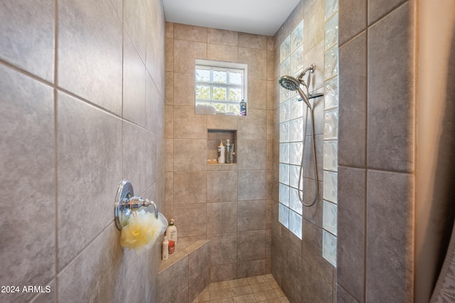 bathroom with tiled shower