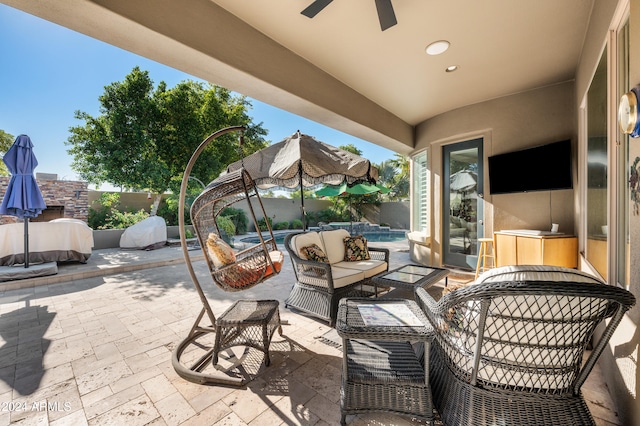 view of patio / terrace with ceiling fan and an outdoor hangout area