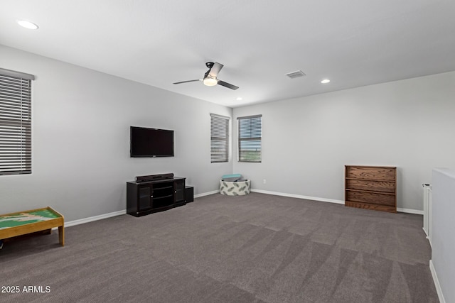 interior space with dark carpet, recessed lighting, baseboards, and a ceiling fan