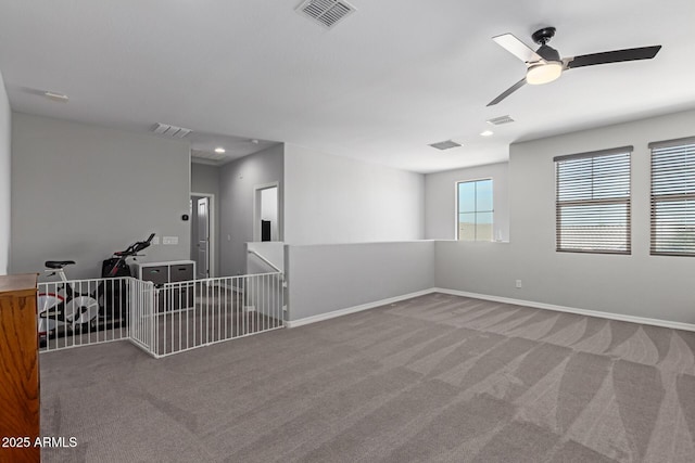 carpeted spare room with ceiling fan, baseboards, and recessed lighting
