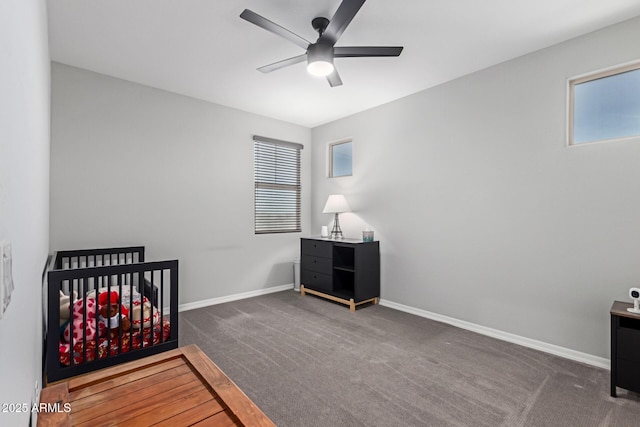 unfurnished bedroom featuring multiple windows, carpet flooring, and baseboards
