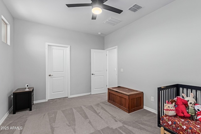 bedroom featuring carpet floors, a ceiling fan, and baseboards