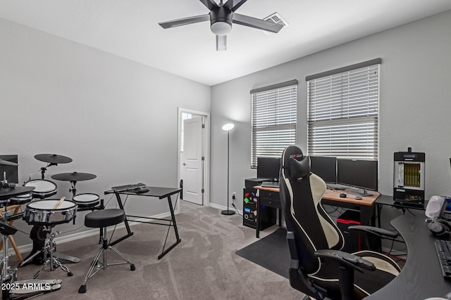 home office with a ceiling fan, carpet floors, and baseboards