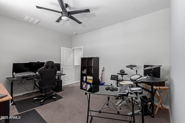 office space with a ceiling fan, carpet flooring, and baseboards