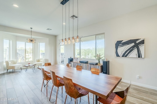 17324 E Quail Track Rd, Rio Verde, AZ 85263 - dining room with wood finished floors, a healthy amount of sunlight, and visible vents