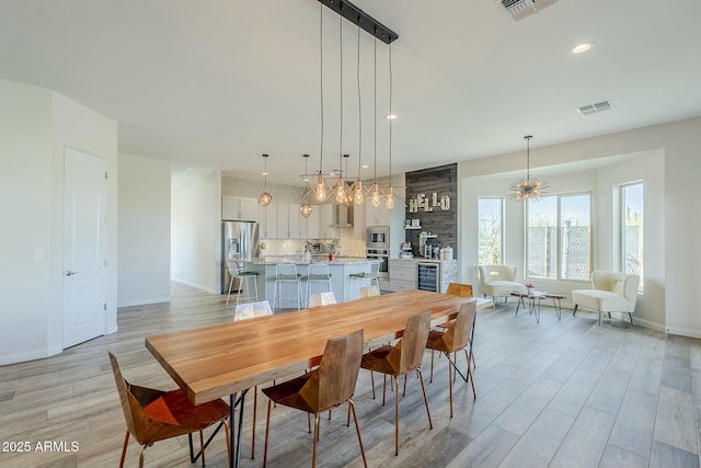 17324 E Quail Track Rd, Rio Verde, AZ 85263 - dining room featuring light wood-type flooring, recessed lighting, baseboards, and visible vents