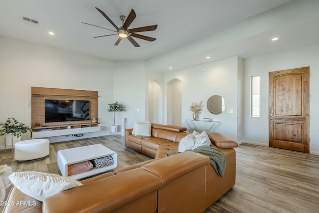 17324 E Quail Track Rd, Rio Verde, AZ 85263 - living room with visible vents, wood finished floors, recessed lighting, a ceiling fan, and arched walkways