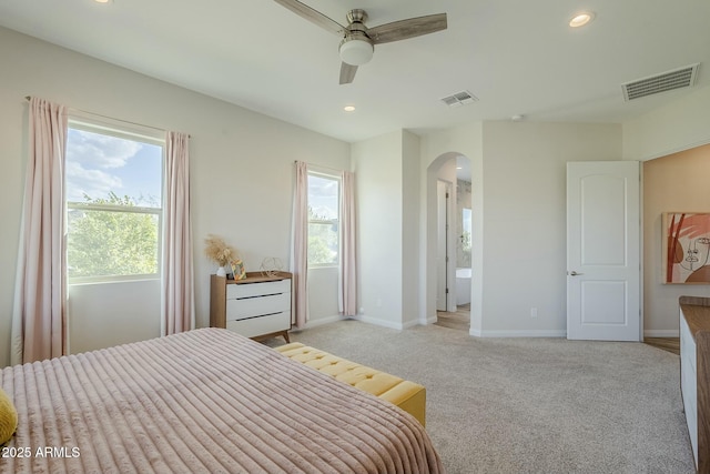 17324 E Quail Track Rd, Rio Verde, AZ 85263 - bedroom featuring arched walkways, visible vents, and multiple windows