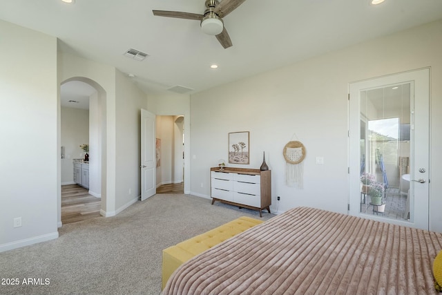 17324 E Quail Track Rd, Rio Verde, AZ 85263 - bedroom with visible vents, arched walkways, light colored carpet, and recessed lighting