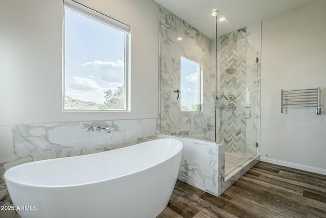 17324 E Quail Track Rd, Rio Verde, AZ 85263 - full bathroom with a soaking tub, a stall shower, tile walls, and wood finished floors