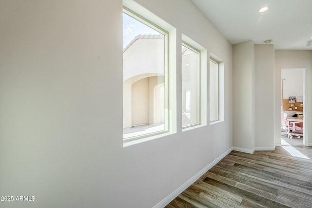 17324 E Quail Track Rd, Rio Verde, AZ 85263 - hallway with baseboards, wood finished floors, recessed lighting, and a healthy amount of sunlight