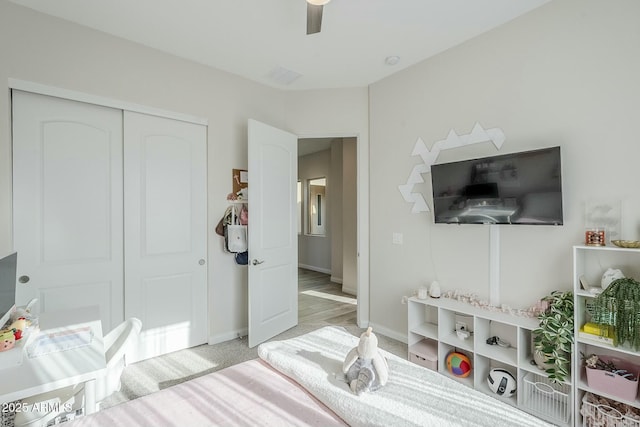 17324 E Quail Track Rd, Rio Verde, AZ 85263 - bedroom featuring a closet, baseboards, a ceiling fan, and light colored carpet