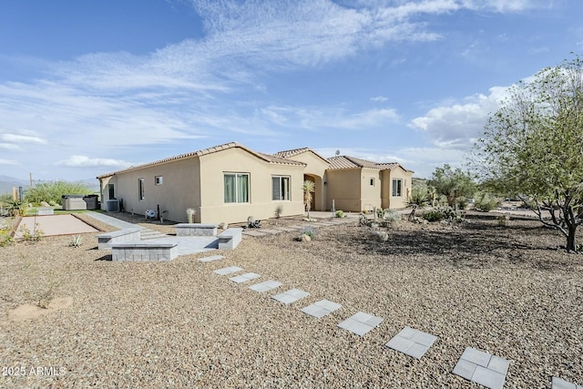 17324 E Quail Track Rd, Rio Verde, AZ 85263 - rear view of property with stucco siding and a tiled roof