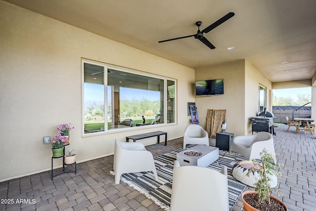 17324 E Quail Track Rd, Rio Verde, AZ 85263 - view of patio / terrace with an outdoor fire pit and a ceiling fan