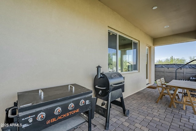 17324 E Quail Track Rd, Rio Verde, AZ 85263 - view of patio / terrace with a grill, outdoor dining space, and fence