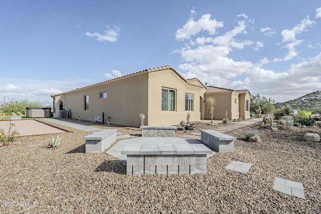 17324 E Quail Track Rd, Rio Verde, AZ 85263 - back of property featuring stucco siding, a tile roof, and cooling unit