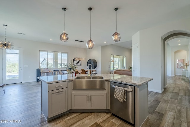 17324 E Quail Track Rd, Rio Verde, AZ 85263 - kitchen featuring a sink, plenty of natural light, light wood finished floors, and stainless steel dishwasher