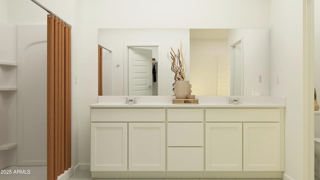 bathroom featuring a shower with curtain, double vanity, toilet, and a sink