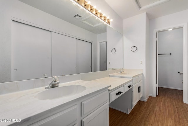 bathroom with vanity and hardwood / wood-style floors