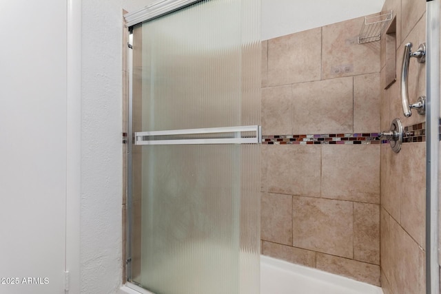 bathroom featuring an enclosed shower