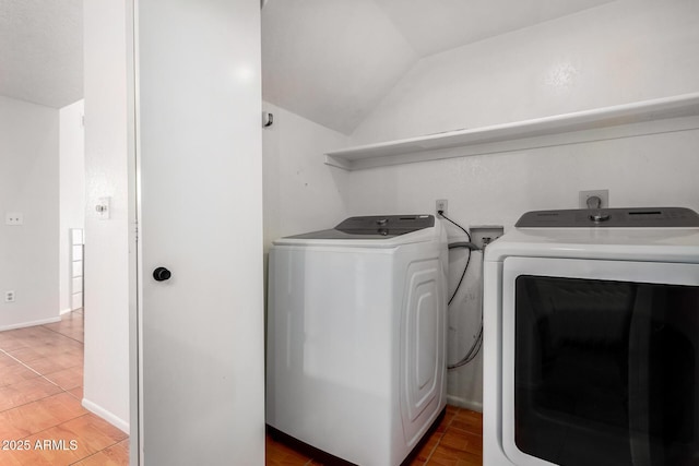 washroom with tile patterned flooring and independent washer and dryer