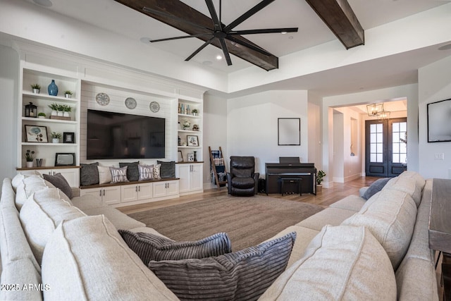 18125 W Montebello Ct Unit 67, Litchfield Park, AZ 85340 - living room featuring a chandelier, light wood-type flooring, ceiling fan, beamed ceiling, and baseboards