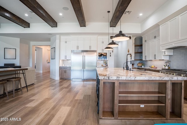 18125 W Montebello Ct Unit 67, Litchfield Park, AZ 85340 - kitchen with open shelves, built in fridge, a sink, backsplash, and beamed ceiling