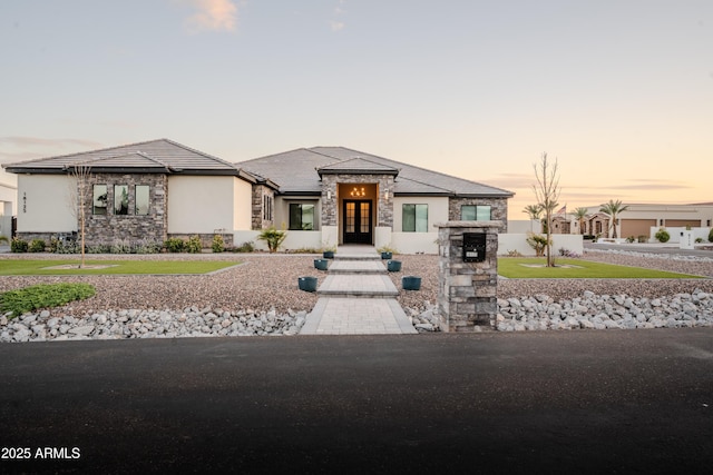 18125 W Montebello Ct Unit 67, Litchfield Park, AZ 85340 - view of front of property with stone siding, french doors, and stucco siding