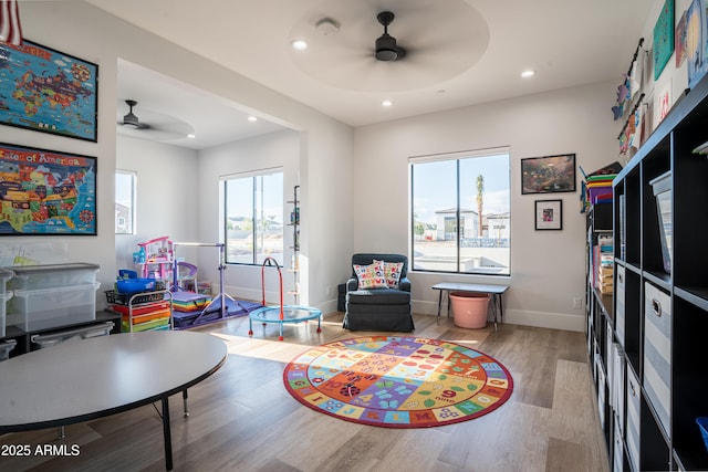 18125 W Montebello Ct Unit 67, Litchfield Park, AZ 85340 - playroom featuring ceiling fan, healthy amount of natural light, wood finished floors, recessed lighting, and baseboards