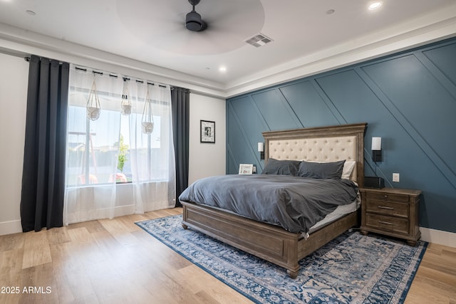 18125 W Montebello Ct Unit 67, Litchfield Park, AZ 85340 - bedroom featuring wood finished floors, a decorative wall, baseboards, a ceiling fan, and recessed lighting