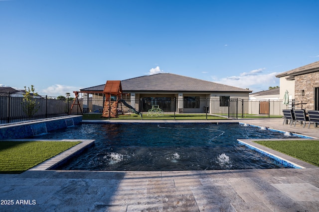 18125 W Montebello Ct Unit 67, Litchfield Park, AZ 85340 - view of pool with a fenced backyard, a patio area, and a playground