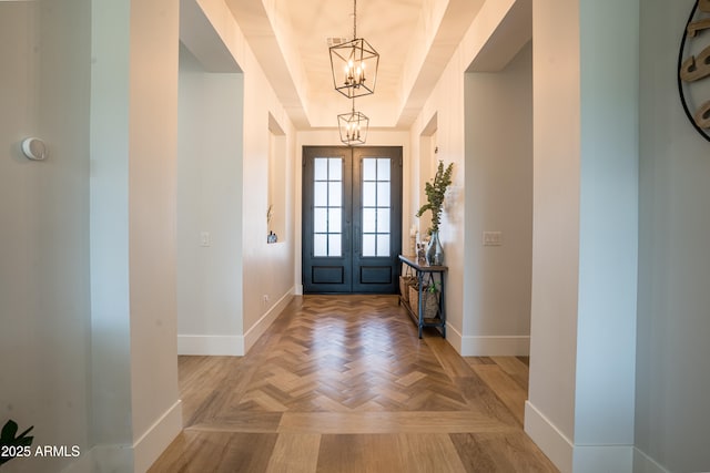 18125 W Montebello Ct Unit 67, Litchfield Park, AZ 85340 - entrance foyer featuring a chandelier, baseboards, and a tray ceiling