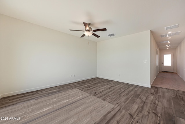 empty room featuring ceiling fan and hardwood / wood-style flooring