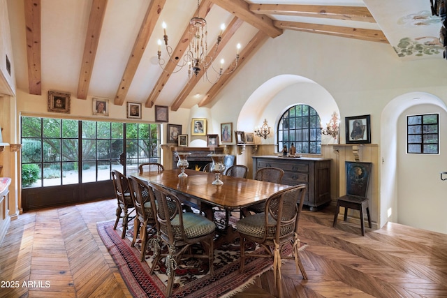 27050 N 103rd St, Scottsdale, AZ 85262 - dining area featuring a chandelier, beam ceiling, arched walkways, and high vaulted ceiling