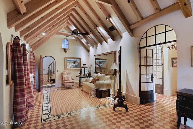 27050 N 103rd St, Scottsdale, AZ 85262 - living area featuring beam ceiling, arched walkways, high vaulted ceiling, baseboards, and a chandelier