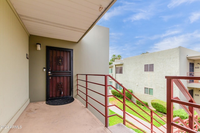 entrance to property featuring a balcony