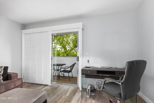 office area with light hardwood / wood-style floors