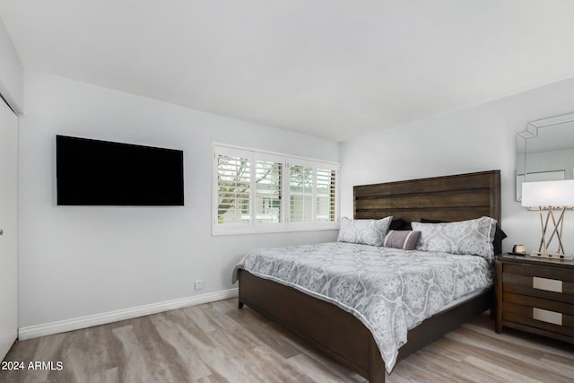 bedroom with light wood-type flooring