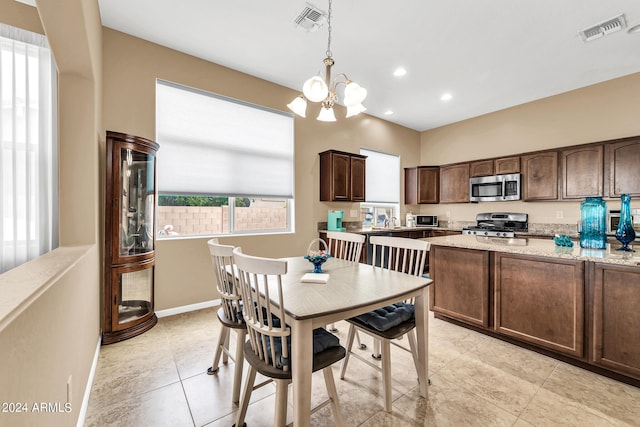 dining room featuring a chandelier, recessed lighting, visible vents, and baseboards