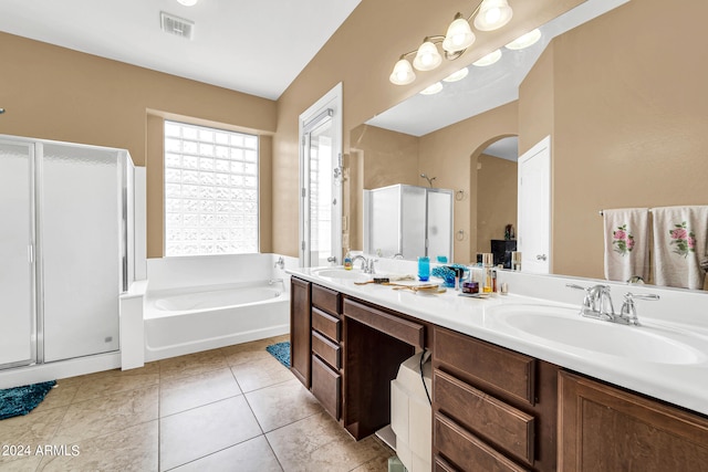 bathroom with tile patterned flooring, a sink, visible vents, a shower stall, and a bath