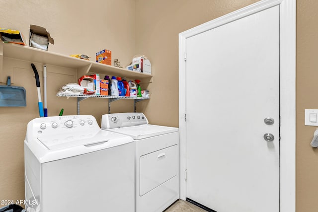 clothes washing area featuring laundry area and independent washer and dryer