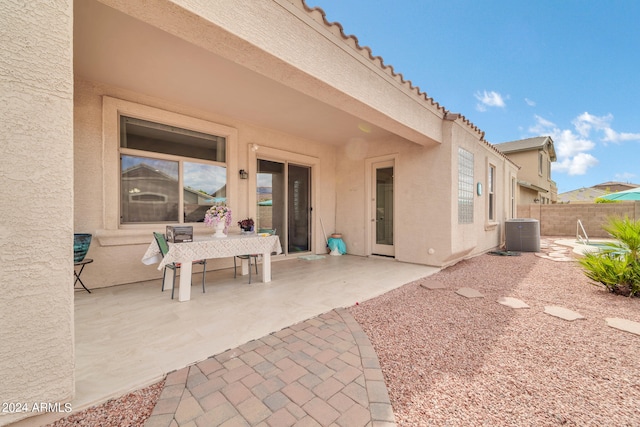 view of patio / terrace with fence and central AC