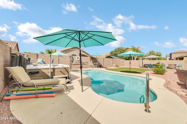 view of swimming pool with a patio area, a fenced backyard, and a fenced in pool