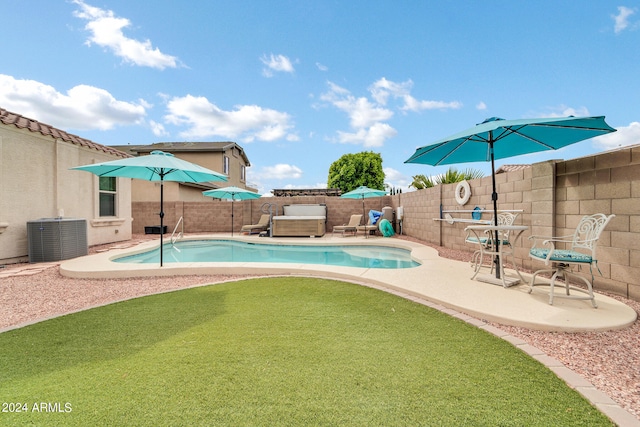 view of pool featuring a fenced in pool, a fenced backyard, a patio, and central AC unit