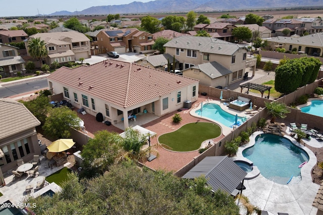 drone / aerial view with a residential view and a mountain view