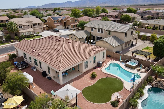 aerial view featuring a mountain view and a residential view