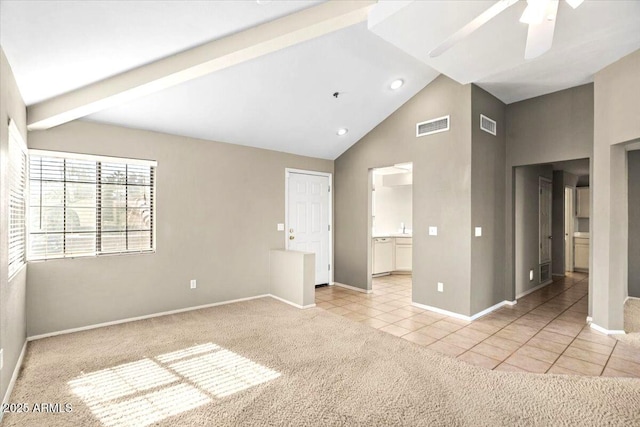 carpeted spare room featuring ceiling fan, high vaulted ceiling, and beam ceiling