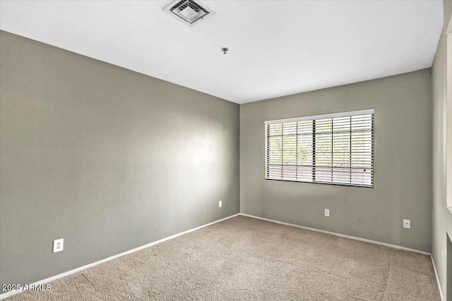 unfurnished room featuring carpet