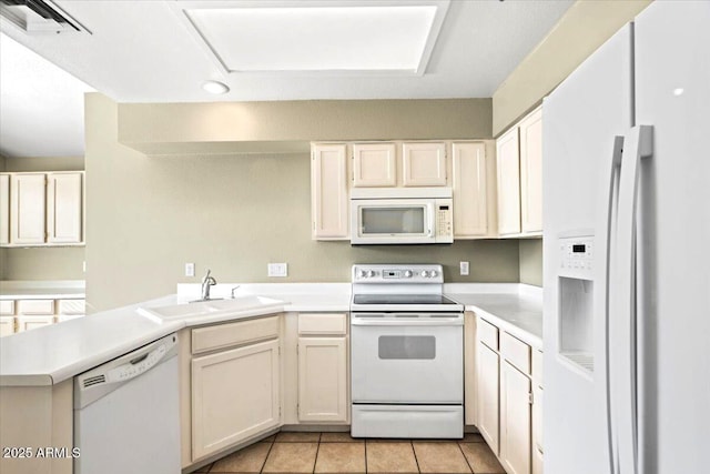 kitchen with sink, white appliances, kitchen peninsula, and light tile patterned floors